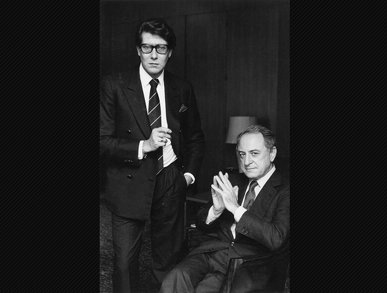 Yves Saint Laurent e Pierre Bergé de terno preto